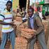 Workers in Kakamega offload eggs imported from Uganda.