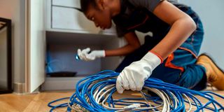 A technician installs home internet.