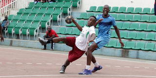 Polycarp Rakama (left) of Technical University of Kenya vies with Augustine Okwiri of General Service Unit 