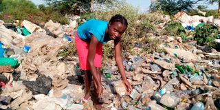 Alice Wambui Chege, 16, at Dandora dumpsite where she works.