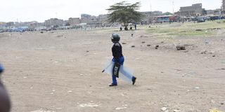 A police officer patrols Jacaranda grounds in Nairobi