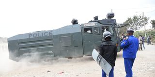 A police water canon leaving Jacaranda grounds