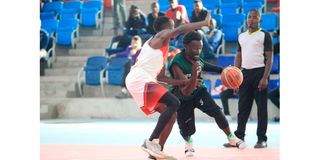 City Thunder point guard Griffin Ligare (right) dribbles for a basket past University of Nairobi "Terror" David Odanga