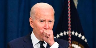 US President Joe Biden coughing