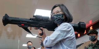 Taiwanese President Tsai Ing-wen holding an anti-tank rocket device