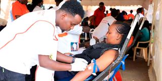 A woman donating blood.