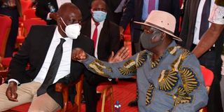 Deputy President William Ruto confers with ODM party leader Raila Odinga