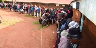 Members of the public queue to cast the ballot at Limnyomoi Primary School Polling Station in Soy Constituency.