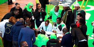 Observers and party agents compare notes at the Independent Electoral and Boundaries Commission’s desk, Bomas of Kenya.