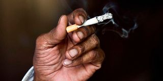 An Indian man smokes a cigarette in New Delhi.