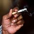 An Indian man smokes a cigarette in New Delhi.