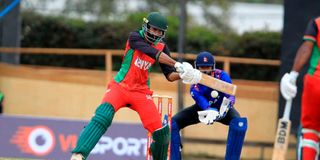 Kenya's batsman Irfan Karim (left) bats under pressure from Nepal's Wicketkeeper Aarif Sheikh 