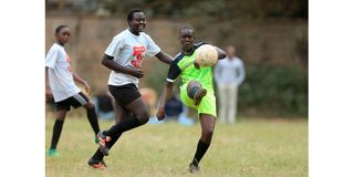 Milvarelvine Liyosi (left) of Buru Buru Girls vies with Miriam Susan of Dagoretti Mixed Secondary School 