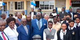 Education CS Prof. George Magoha and Uasin Gishu High School Principal Mercy Juma.