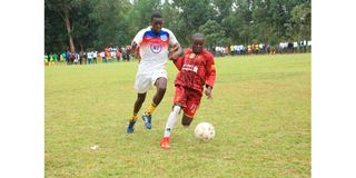 Calvins Otieno (left) of Ong'icha Secondary School vies with Alphonse Asewe of Nyamache Boys