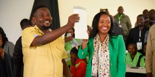 Susan Kihika celebrates victory with her husband Sam Mburu.