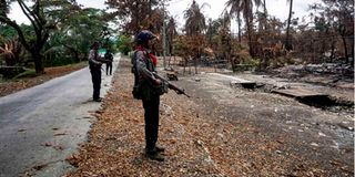 Police look at Myo Thu Gyi Muslim village