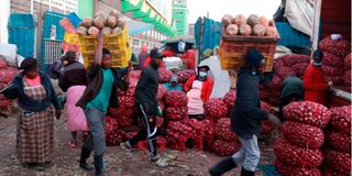 Traders selling their produce at Marikiti Market.