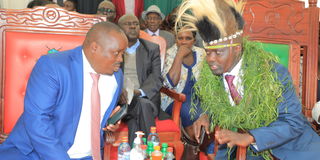 Outgoing Elgeyo Marakwet Governor Alex Tolgos (right) chatting with Governor Wisley Rotich