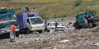 Trucks offload solid waste at Gioto dumpsite in Nakuru Town.