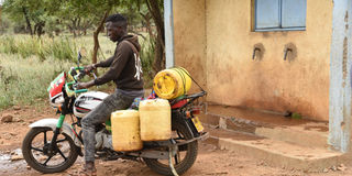  A boda-boda rider ferries was from Mokongwo/Kasitet water project in Tangulbei, baringo County on July 29, 2021