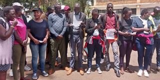 Youths protesting over alleged Qatar World Cup jobs outside the Uasin Gishu County Commissioner’s officers in Eldoret town