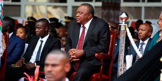 Former President Uhuru Kenyatta follow proceedings at Kasarani Stadium.