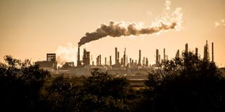 Smoke cloud rises from an oil petroleum refinery