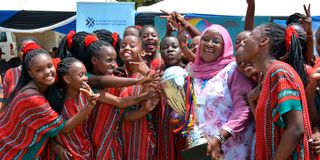 Mama Ngina Girls from Coast Region celebrate alongside their Principal Omar Mwanahamisi