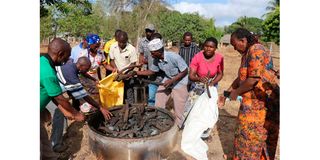 Locals carrying charcoal.