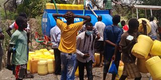 Lodwar town residents scramble for water outside Lodwar Water and Sanitation Company office on September 19, 2022