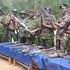 Rift Valley Regional Commissioner Maalim Mohamed (third right) displaying illegal guns recovered in Kerio Valley