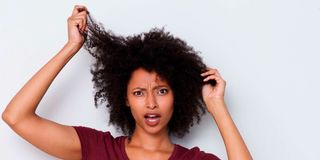 Woman stressed with hair.