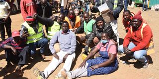 Mr William Chepkut (centre-then Ainabkoi MP) with matatu drivers, conductors and boda-boda-riders during a protest