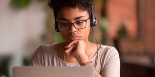 Woman with laptop online