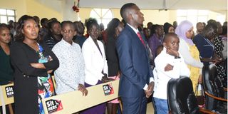 Family members of the late William Chepkut at a requiem mass at Africa Inland Church Fellowship in Eldoret town