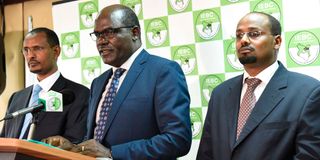 IEBC chairman Wafula Chebukati (centre) with commissioners Prof Yusuf Guliye (left) and Boya Molu