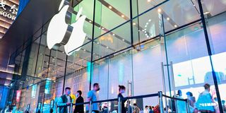 People visit an Apple store in Shanghai