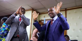President William Ruto shakes hands with former ICT cabinet secretary Joe Mucheru