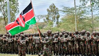 KDF soldiers attend a flag presentation ceremony before their deployment to the DRC