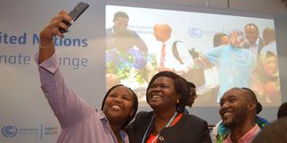 Homa Bay Governor Gladys Wanga take a photo with some Kenyans at the COP27