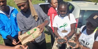 Young hikers share seed balls 