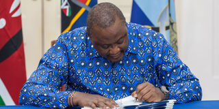 Former President Uhuru Kenyatta signs Bills