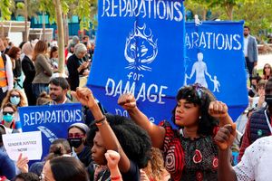 Climate activists demonstrate at the Sharm el-Sheikh International Convention Centre, Egypt