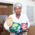 Judy Mugure from Kinoo in Kiambu displays coconut chips which she makes from raw coconut.