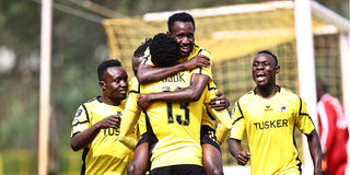 Tusker striker Deogratious Ojok celebrates with teammates 