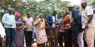 Prime Cabinet Secretary Musalia Mudavadi (third left) and other leaders dance during Vihiga Cultural Society