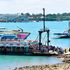 Passengers board MV Harambee as MV Safari arrives at the Likoni crossing