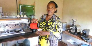 Josephine Wangui pours herself a cup of Kombucha coffee. 