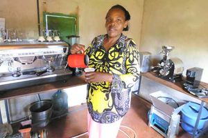 Josephine Wangui pours herself a cup of Kombucha coffee. 